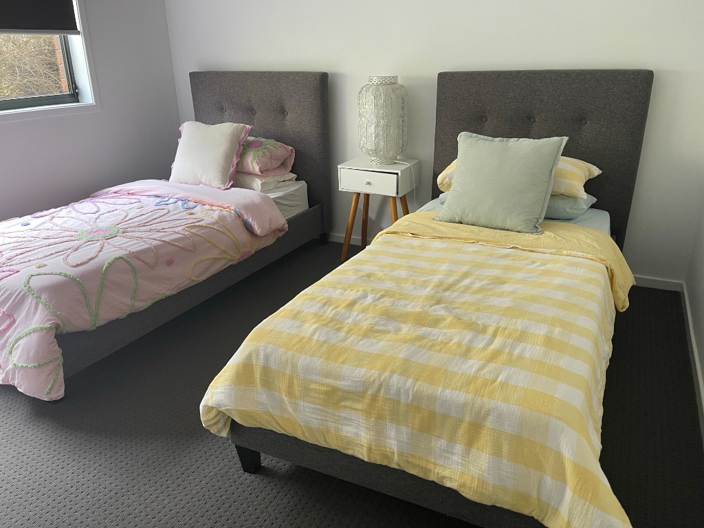 Comfortable bedroom with two single beds