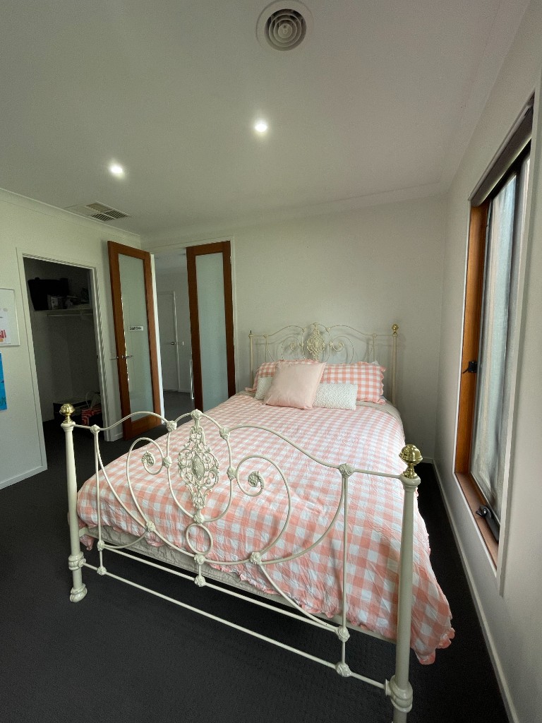 Cozy bedroom with double bed and natural light